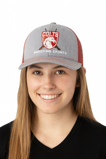 Girl wearing a red Colts' Shooting Sports baseball cap