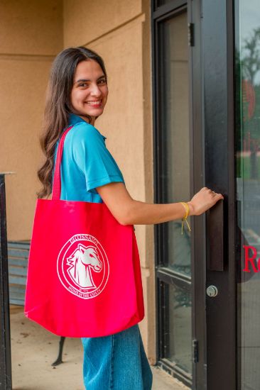 College student with a red tote bag