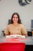 College student wearing sand cotton t-shirt